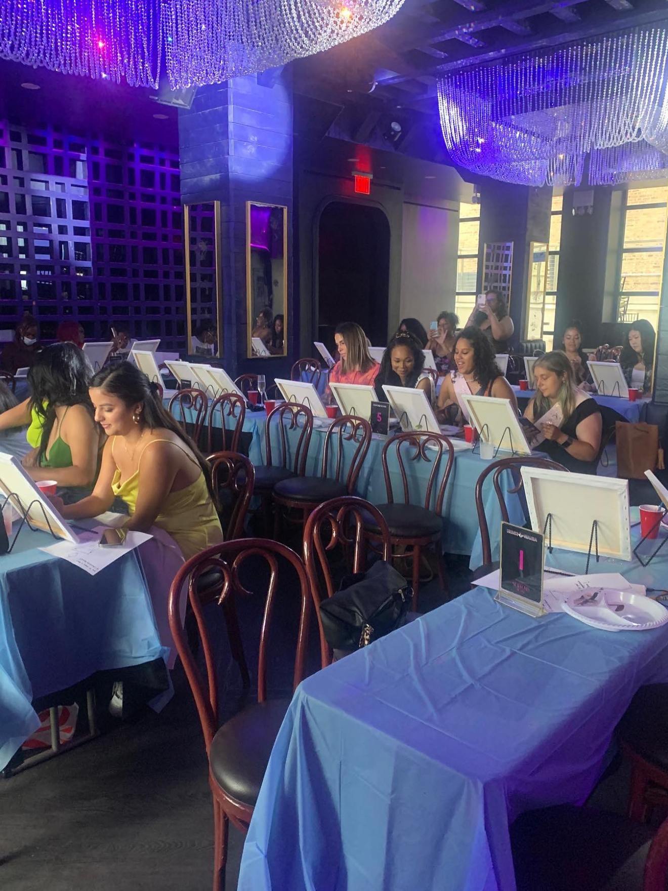 a group of people sitting at a table