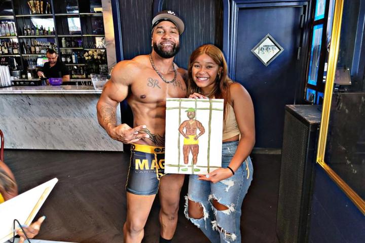 a person standing in front of a group of people posing for the camera