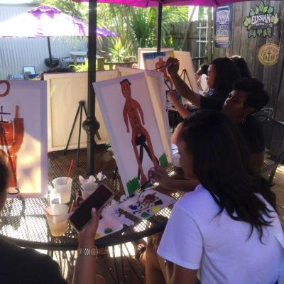 a group of people sitting at a table in a restaurant