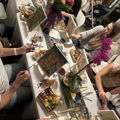 a woman cutting a cake
